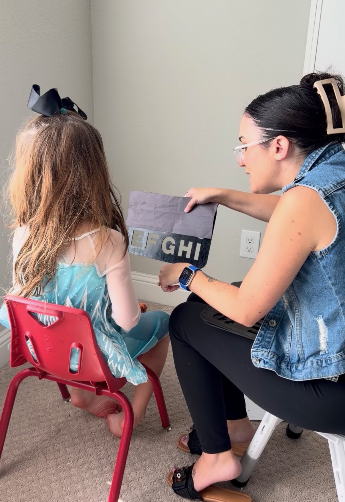 Sunny supporting a student during a spelling session